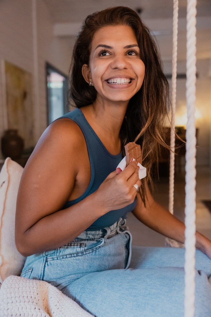 Happy Woman Eating Chocolate